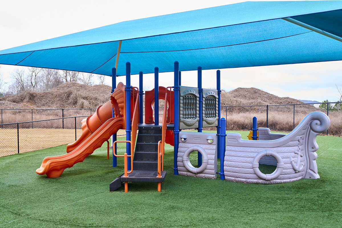 Age-Level Playgrounds, A Splash Pad, & Lawns Keep Them Moving